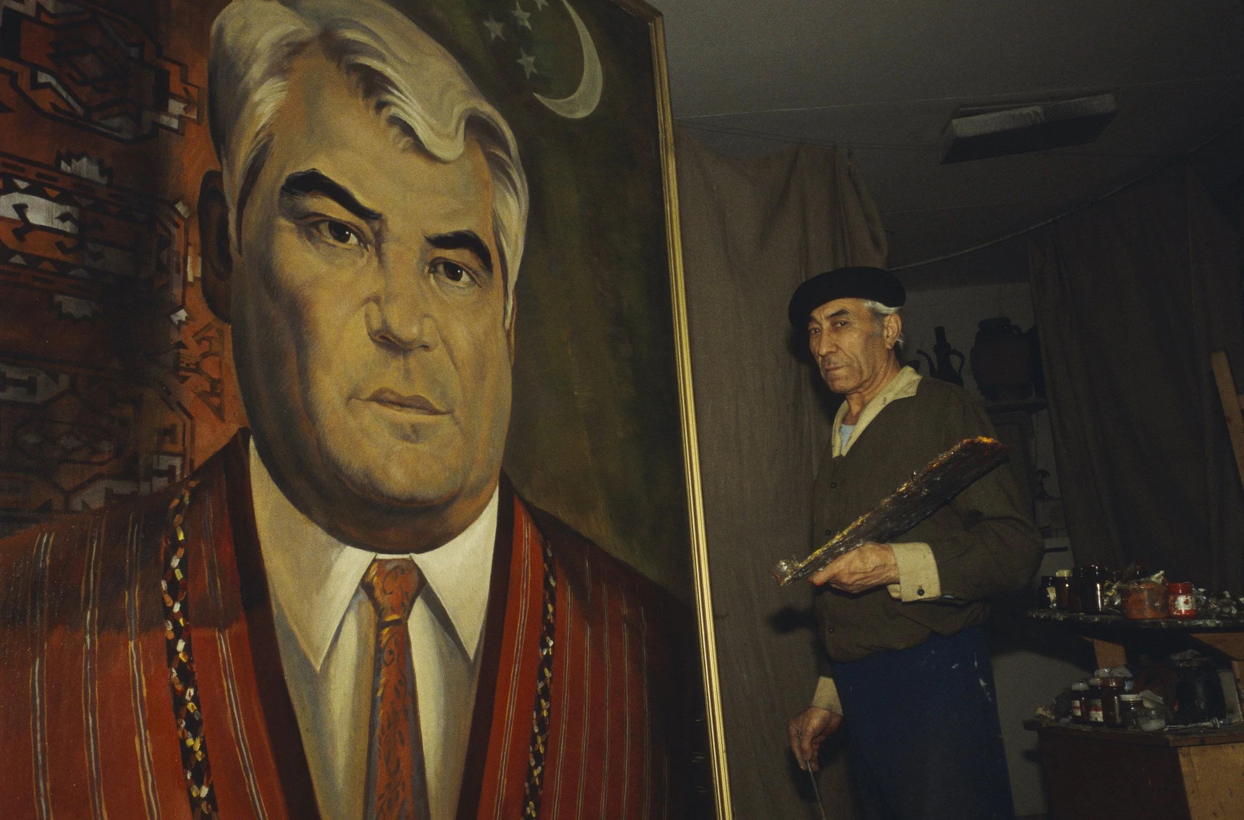 A painting of Turkmen President Saparmurat Niyazov with its author. Turkmenistan, Turkmenbashi, 1995