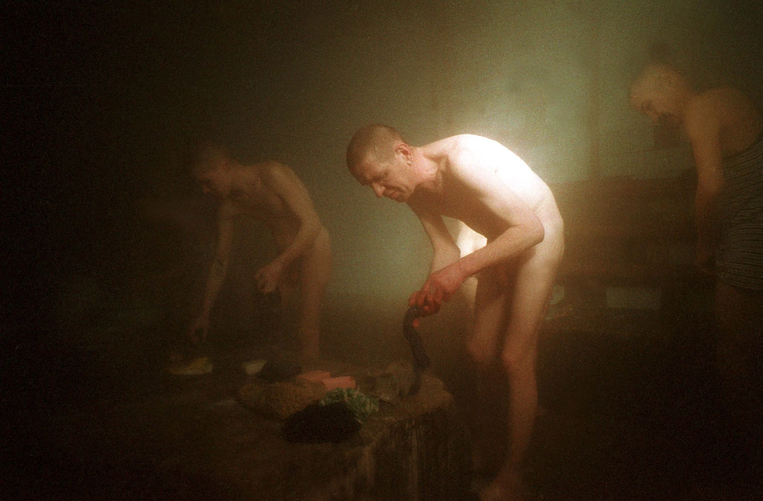 The Banya in Colony 33, Mariinsk, Russia. Outside temperatures are -35 degrees celsius, causing a constant stream inside where it is rather warm. March, 2001.