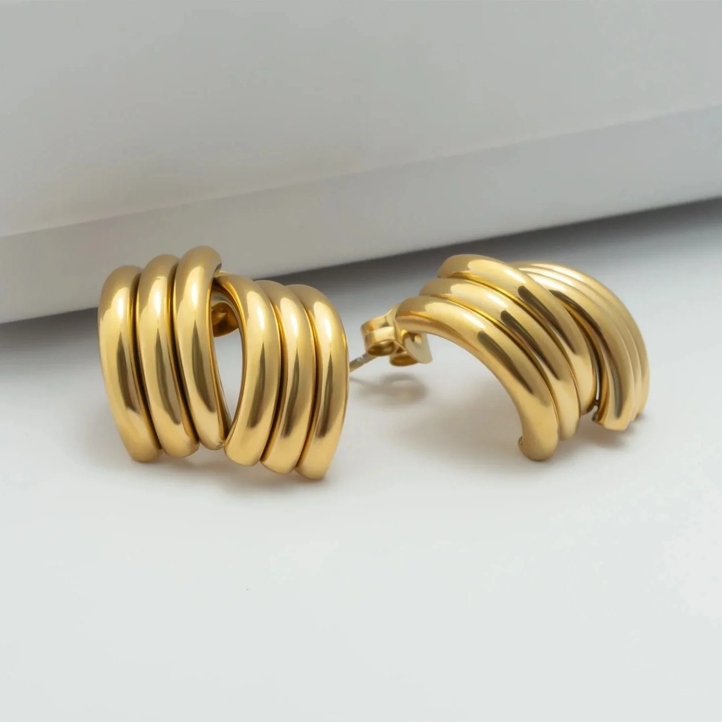 gold-sculptural-stud-earrings-03_.jpg