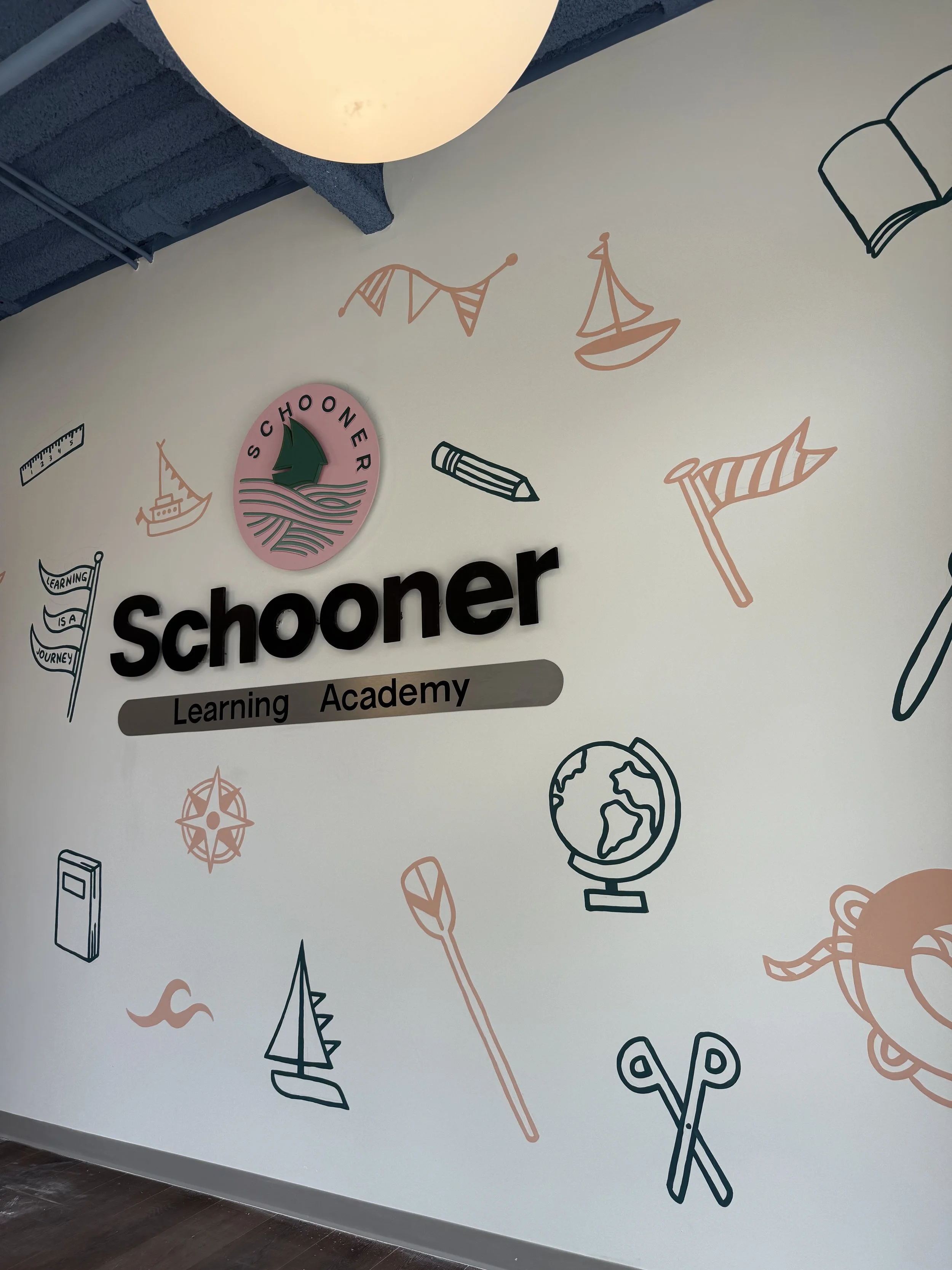 a wall mural at the entrance of a preschool