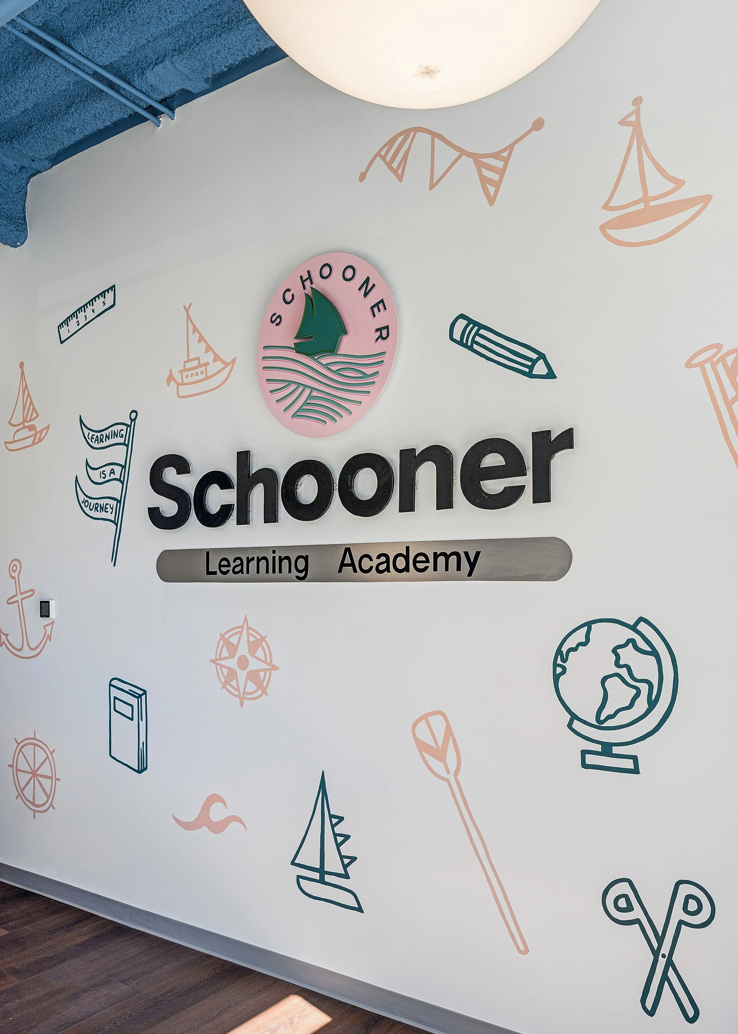 a wall mural at the entrance of a preschool