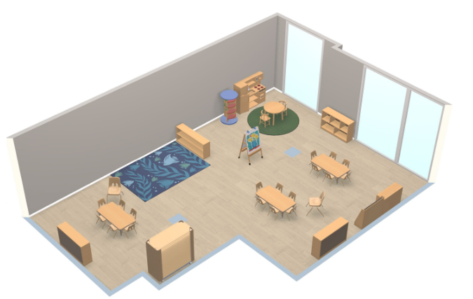 A spacious classroom with multiple small tables and chairs, a colorful rug, and shelves with educational materials, illuminated by large windows.