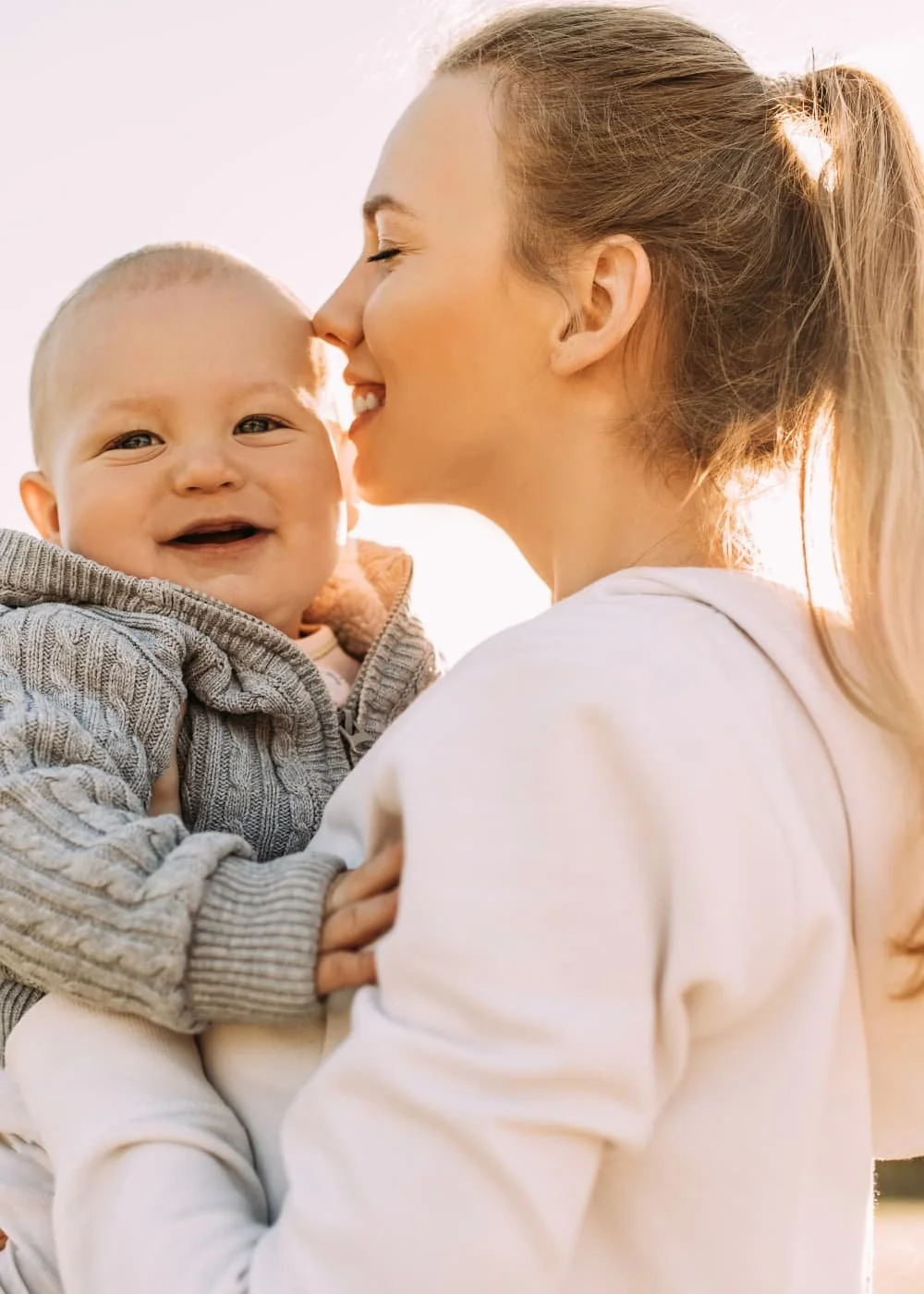 happy mom in therapy for postpartum therapy