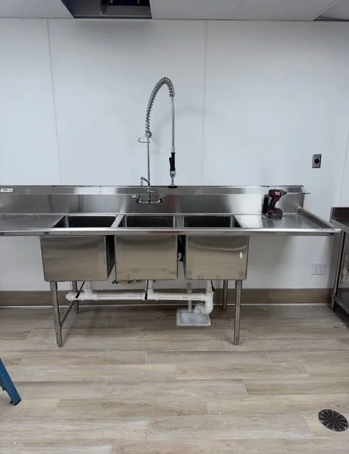 Smart grease trap and commercial sink installation in Duval County for a new restaurant build.