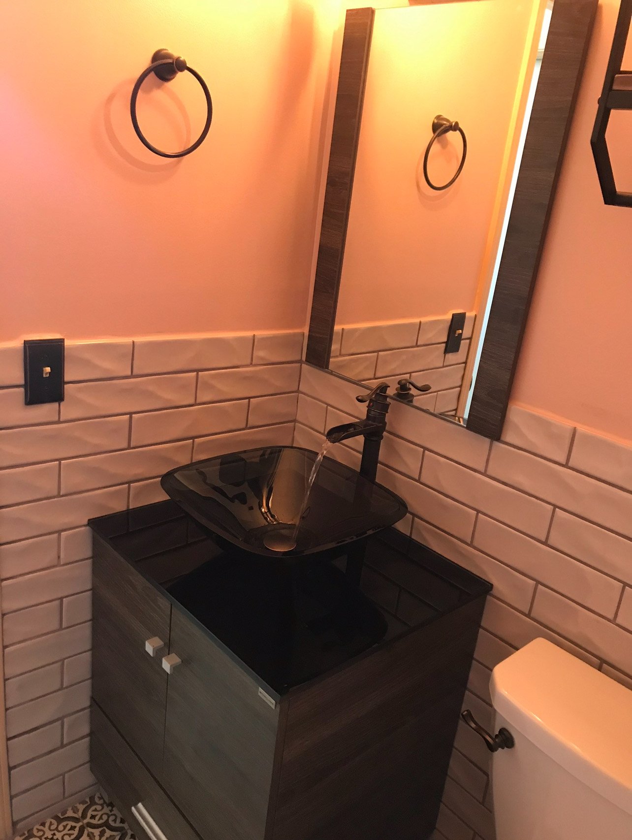 Luxury waterfall faucet installation for a new vessel sink in a Duval County bathroom.