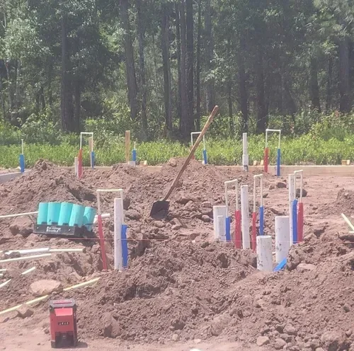 Rough-in plumbing for new construction home with water supply and drain lines