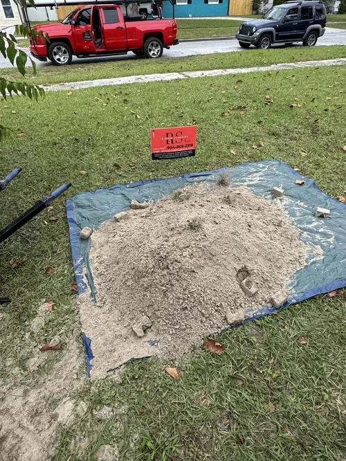 Plumber installing new main water line in residential home