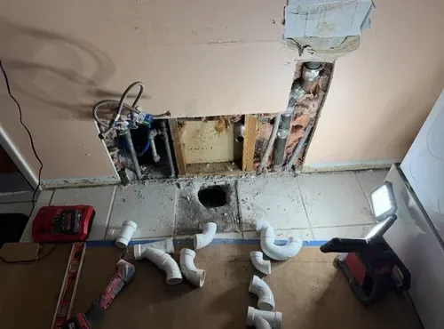 Washer backup service preventing water damage in laundry room