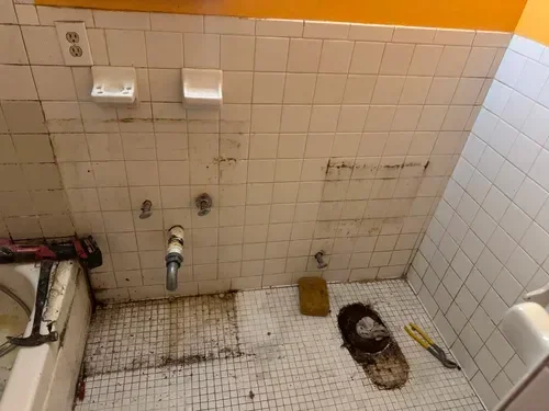 Full bathroom renovation transforming outdated space