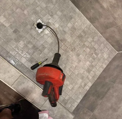 Bathroom drain cleaning service removing hair and soap buildup