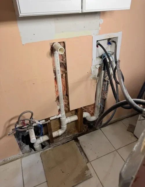 Laundry room renovation with upgraded water supply and drain lines