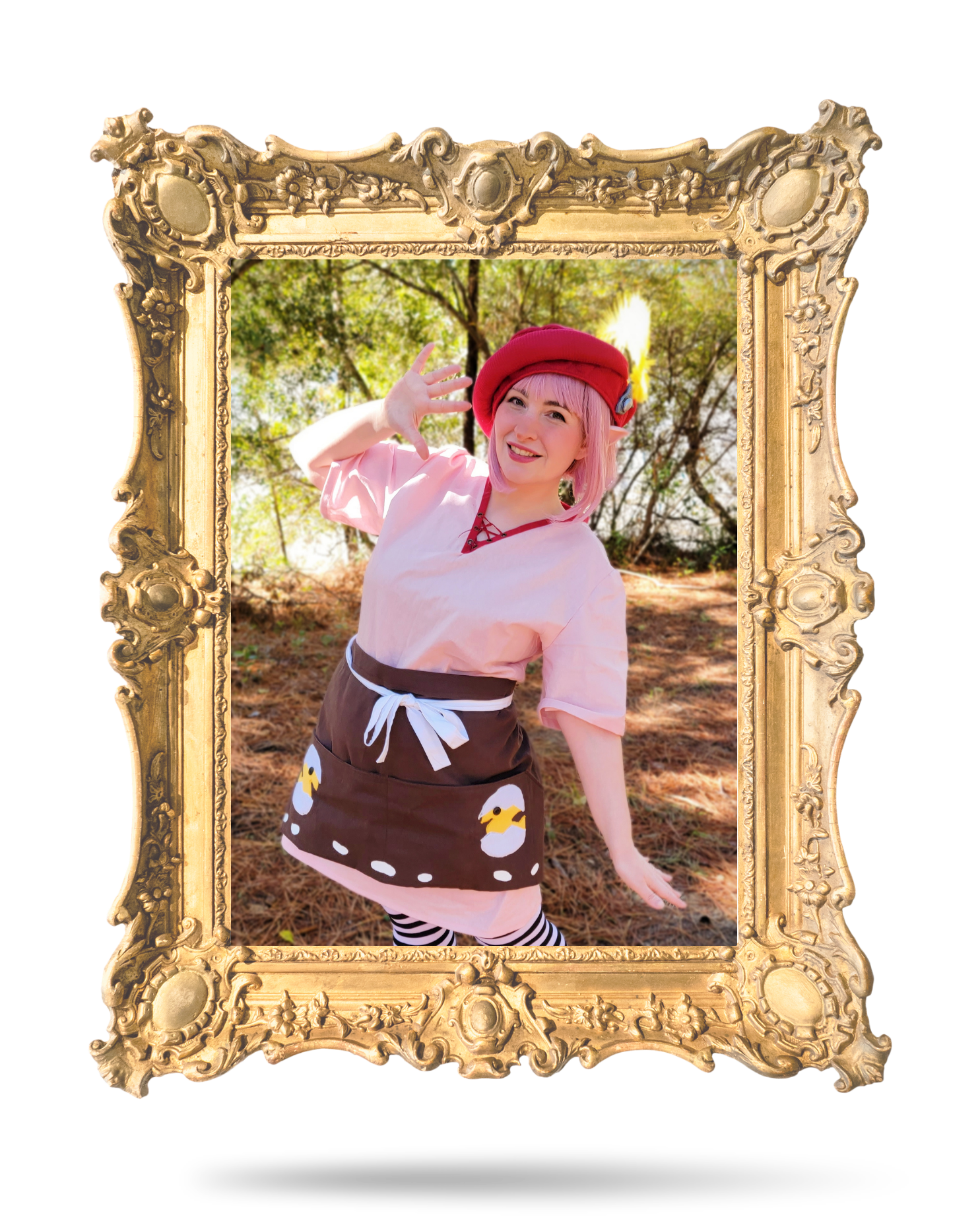 A cosplayer known as A_BYTE_OF_CAKE poses for a photo while wearing a cosplay, the image is within an ornate floating golden frame.