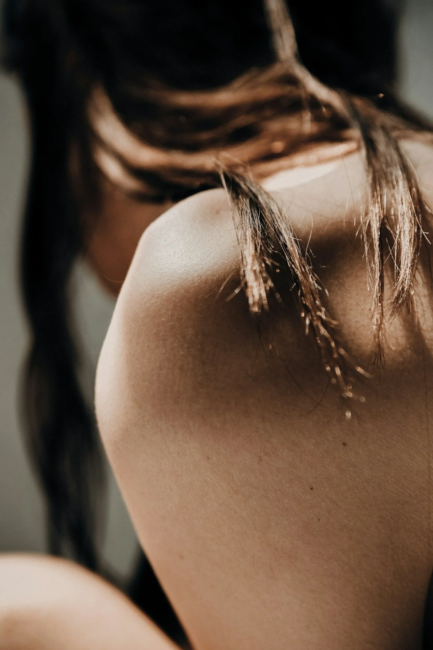 Woman's back of head and shoulder