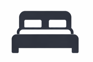 Silhouette of a bed with a headboard and two pillows
