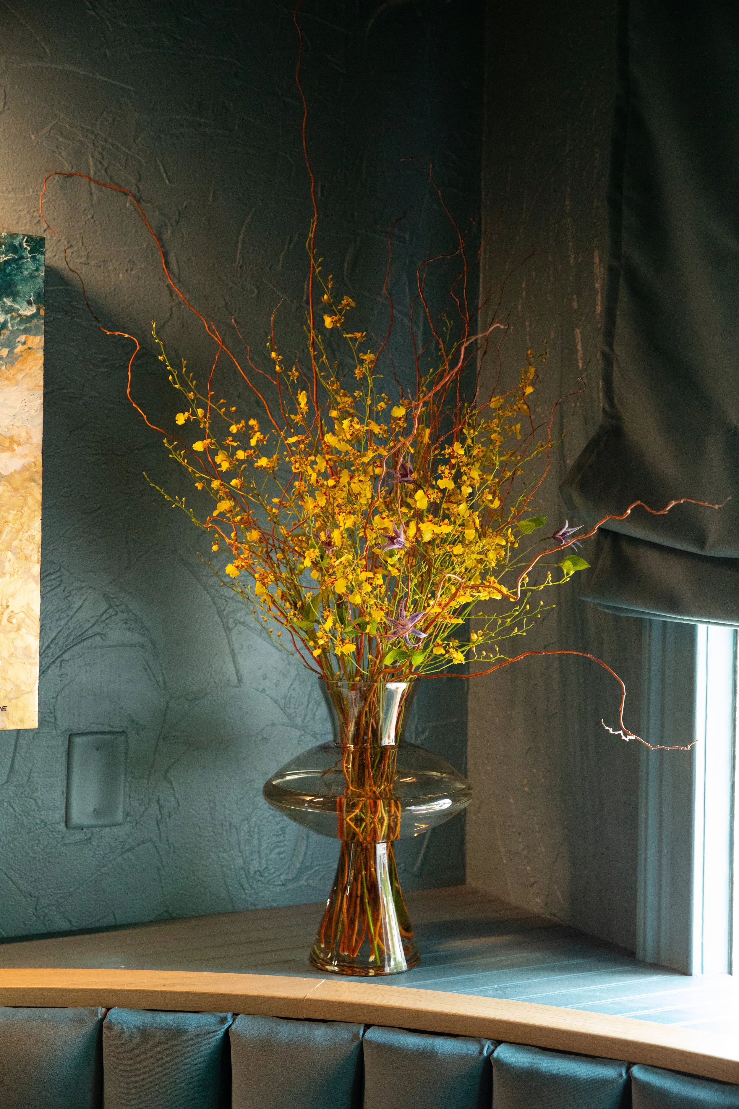 Oncidium Orchids in an artistic vase. Moxie CLT event held at Sala by Stagioni Charlotte NC
