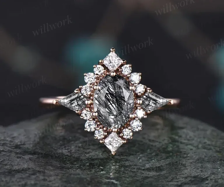 Close-up of an intricate diamond ring with a large, oval-shaped central diamond surrounded by smaller diamonds, set in a detailed metal band.