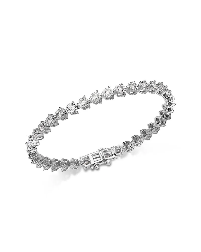 Silver bracelet with embedded diamonds, featuring a secure clasp.