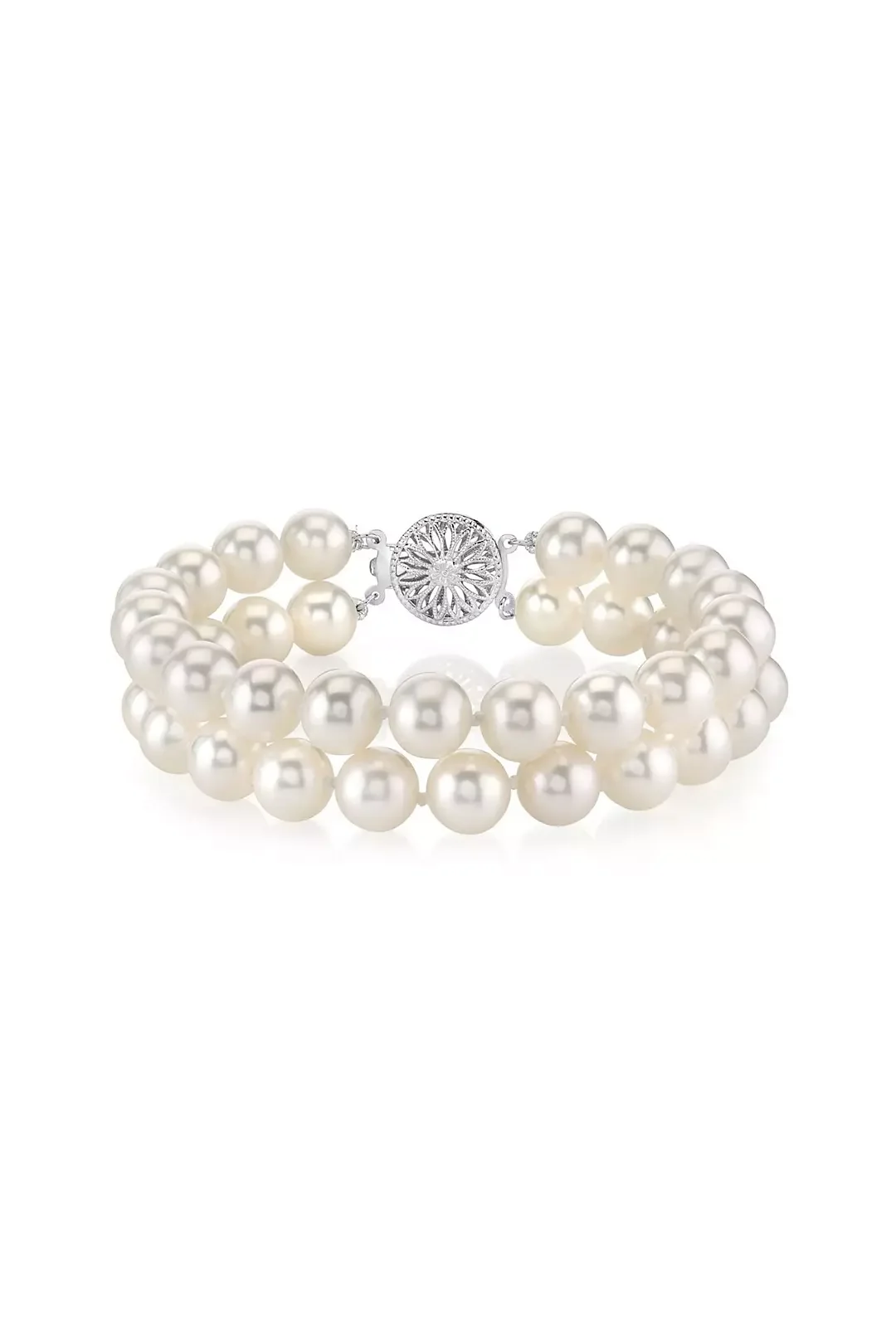 Pearl bracelet with a decorative silver clasp on a white background.