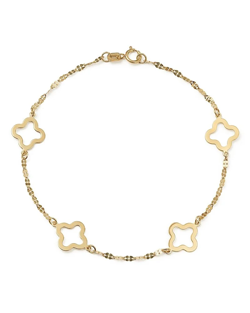 Gold necklace with open quatrefoil-shaped charms evenly spaced along the chain.