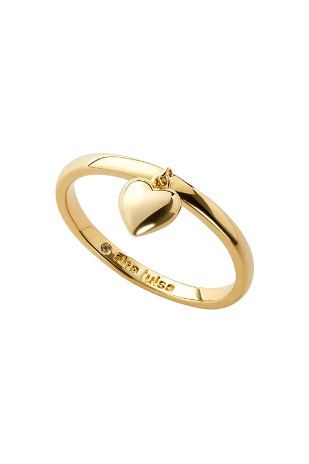 A gold ring with a small engraved gemstone and a heart-shaped pendant hanging from the top, featuring the inscription 'stay true' engraved on the band.