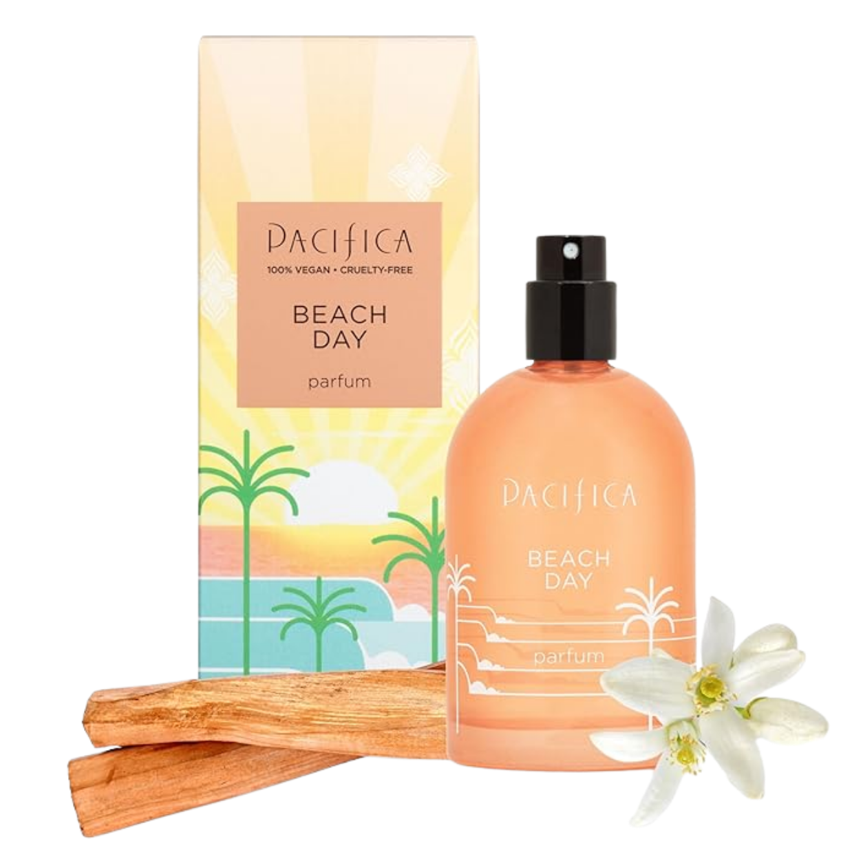 A bottle of Pacifica Beach Day perfume next to its packaging, three pieces of cinnamon sticks, and a white flower, with a tropical sunset and palm tree illustration on the packaging.