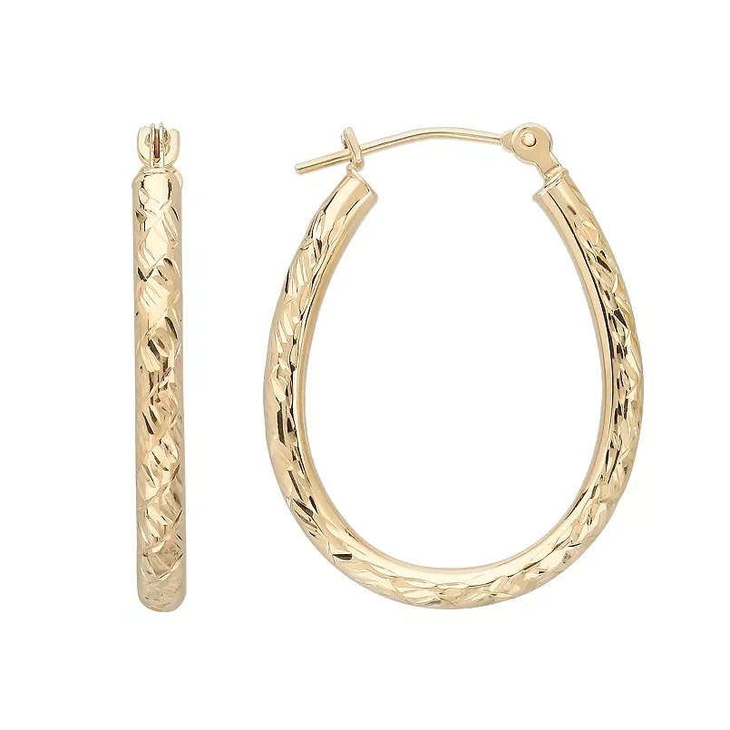 Pair of gold hoop earrings with engraved pattern on a white background.