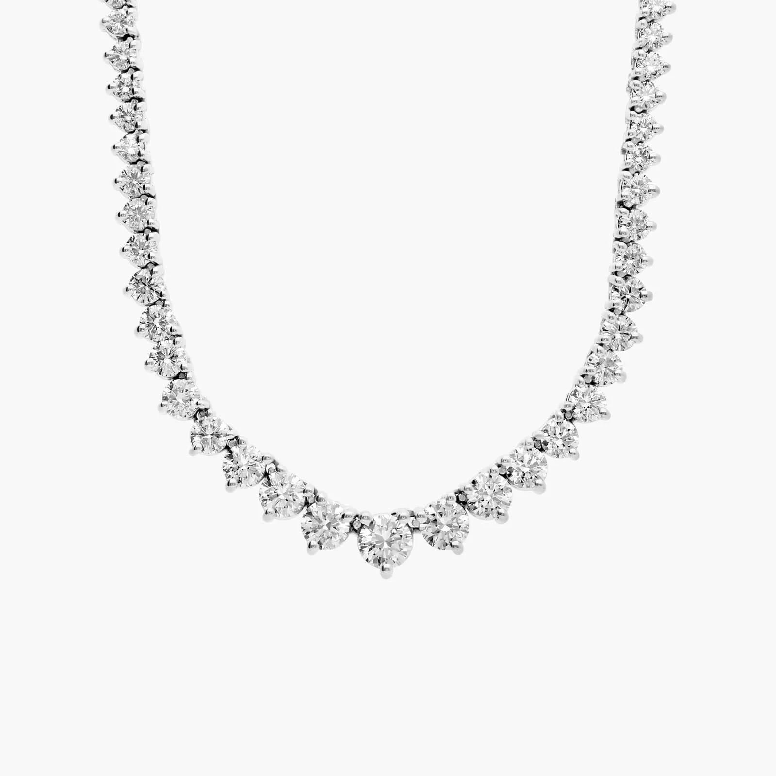 A diamond necklace with heart-shaped stones, displayed against a white background.