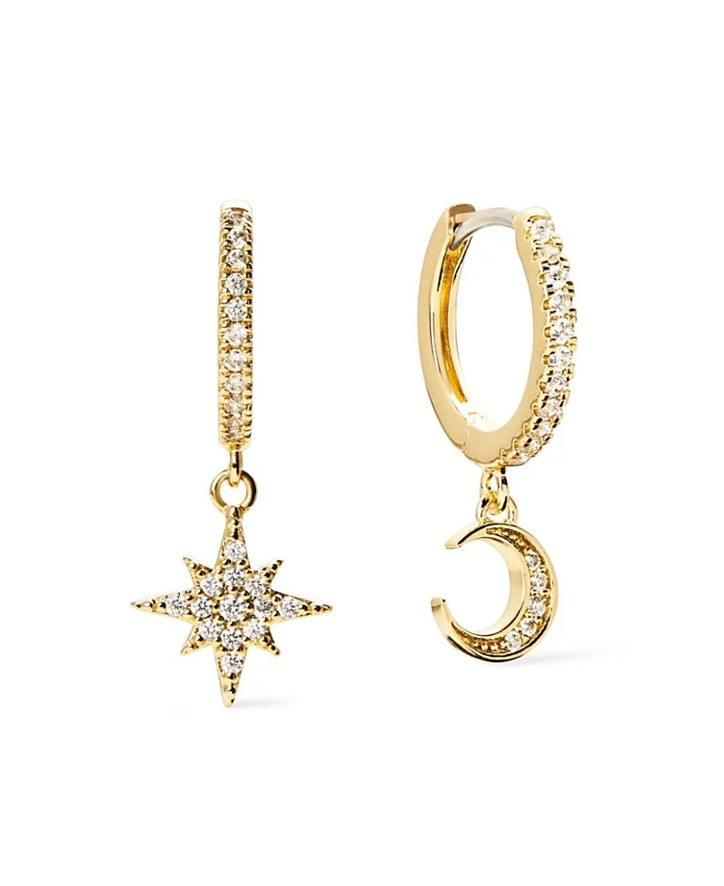 Gold hoop earrings with diamond accents, one featuring a star pendant and the other a crescent moon pendant, against a white background.