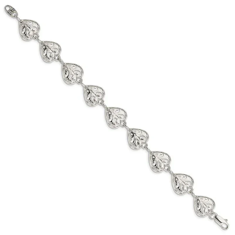 Silver bracelet with ornate heart-shaped links.