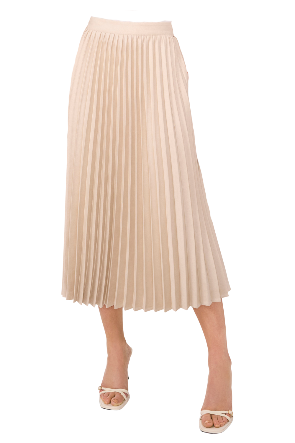 A close-up of a beige pleated midi skirt worn by a person, paired with white high-heeled sandals.