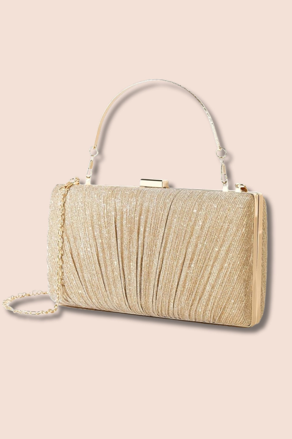 Gold evening clutch purse with chain strap and metallic clasp on a pink background. style ideas, style outfits, everyday wear, night out fit