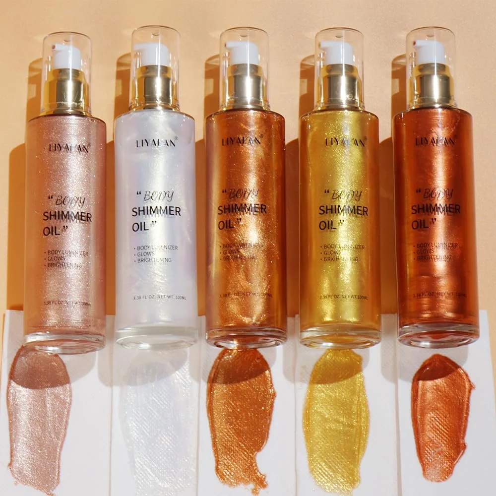 Five bottles of LIYIAN body shimmer oil in different colors: rose gold, white, bronze, gold, and copper. Each bottle has a metallic cap and a clear spray top. Swatched colors are underneath each bottle on a white surface.