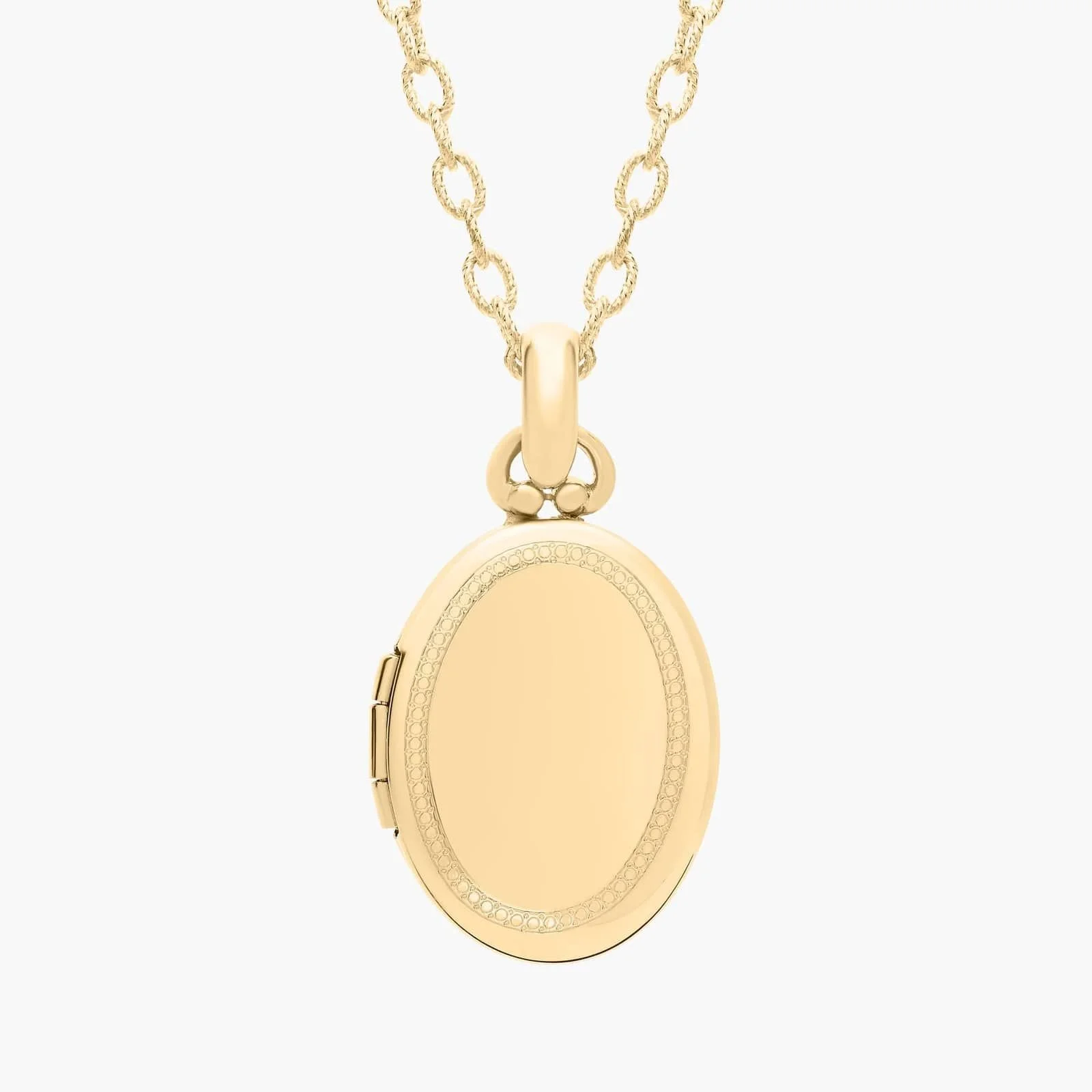 Gold locket necklace on a chain with a plain, oval-shaped locket.