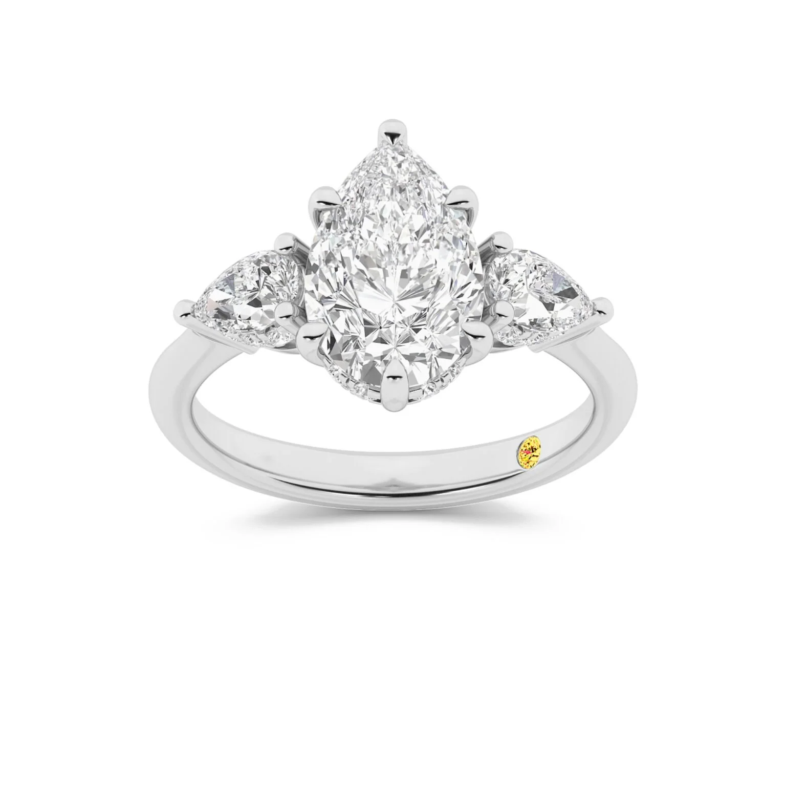 Elegant diamond ring with a marquise-cut diamond center and two pear-shaped diamonds on either side, set in a silver or white gold band.