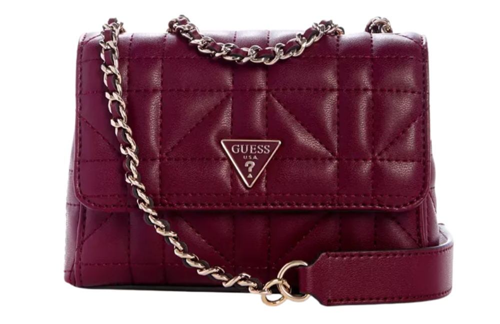 A maroon quilted Guess handbag with a chain strap and a triangular Guess logo on the front.