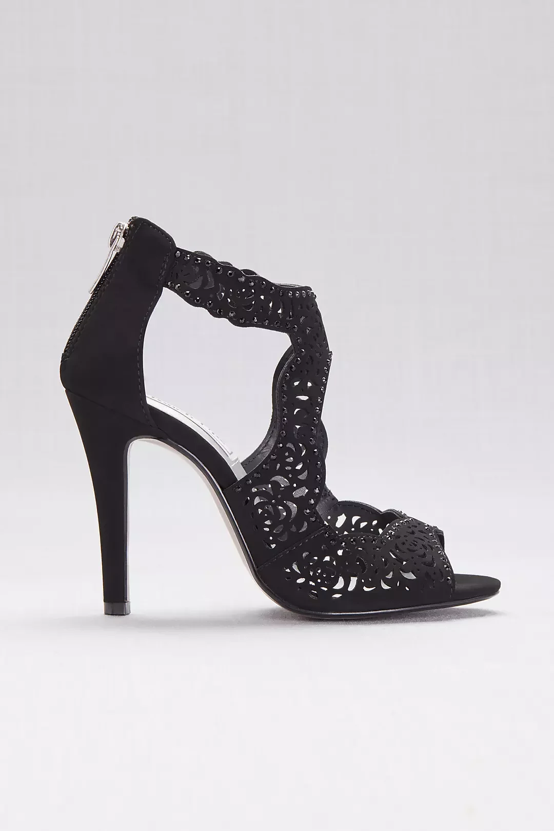 Black high-heeled sandal with intricate cut-out design and ankle strap, side view.