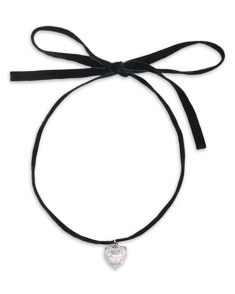 Black velvet choker necklace with a heart-shaped clear crystal pendant and a tied black ribbon.