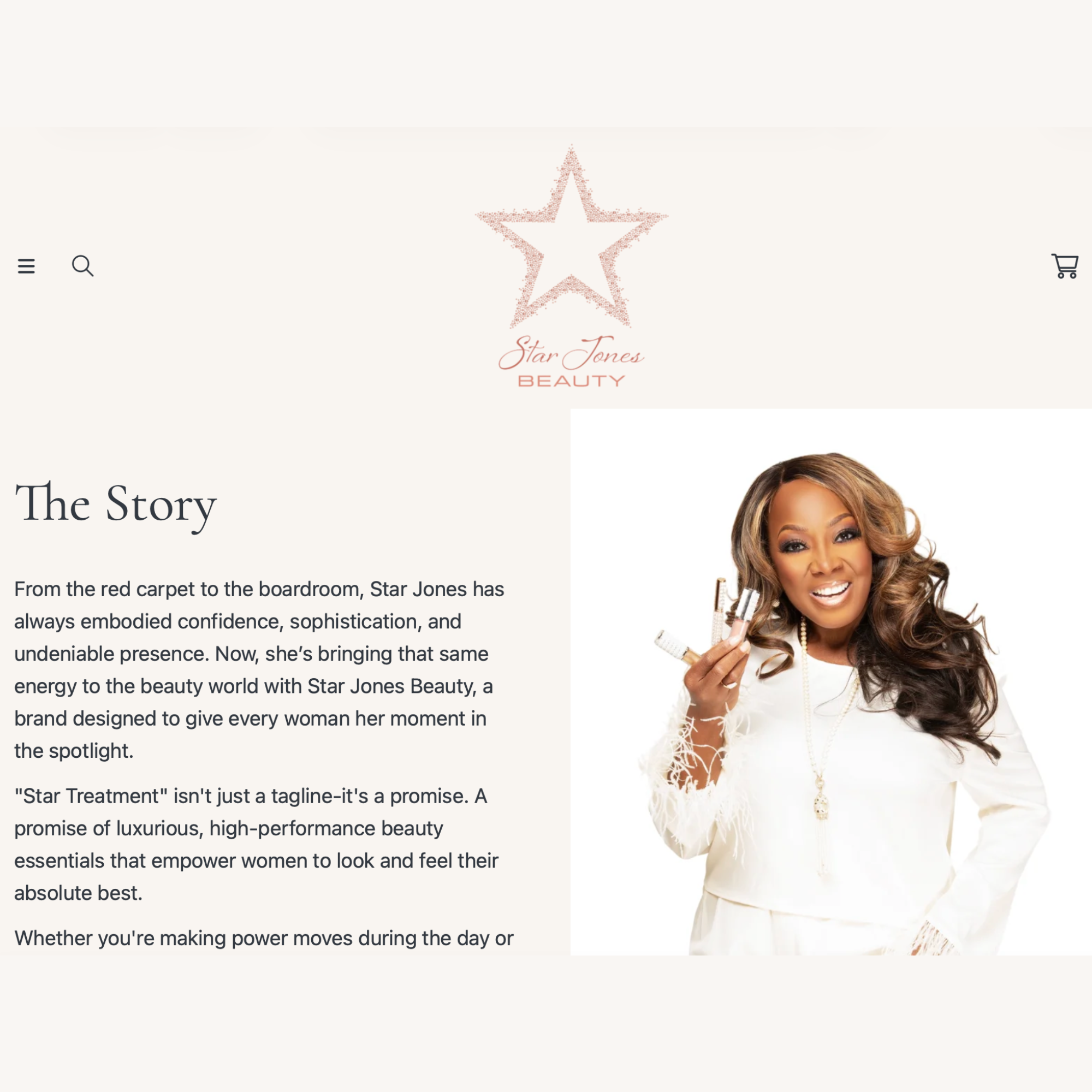 TV personality, Star Jones, with long, curly hair and a bright smile, holding beauty products in her hand, wearing a white top with lace details.