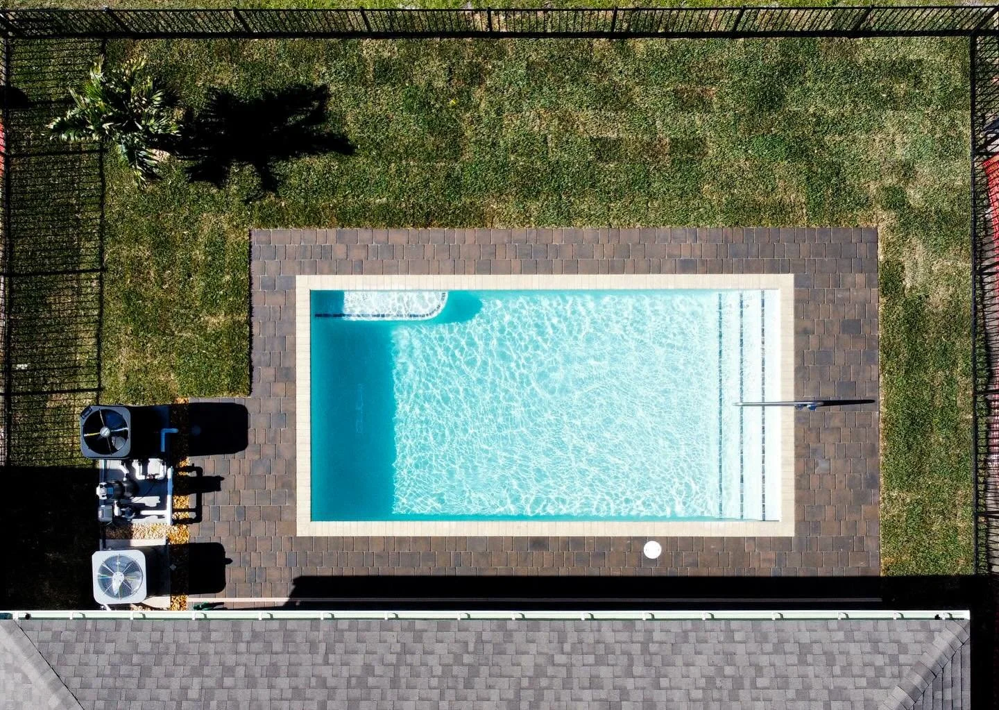 Another beautiful pool completed! ☀️🏊&zwj;♂️

This 12x24 pool features walk-in steps with a handrail for easy entry, perfect for comfort and safety. The sky blue water paired with a dark blue tile line gives the pool a crisp, clean look that really 