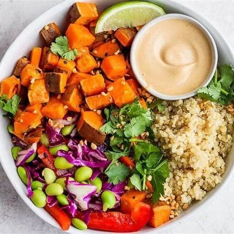 Woman over 40 preparing whole foods in a kitchen, representing sustainable nutrition habits for fat loss