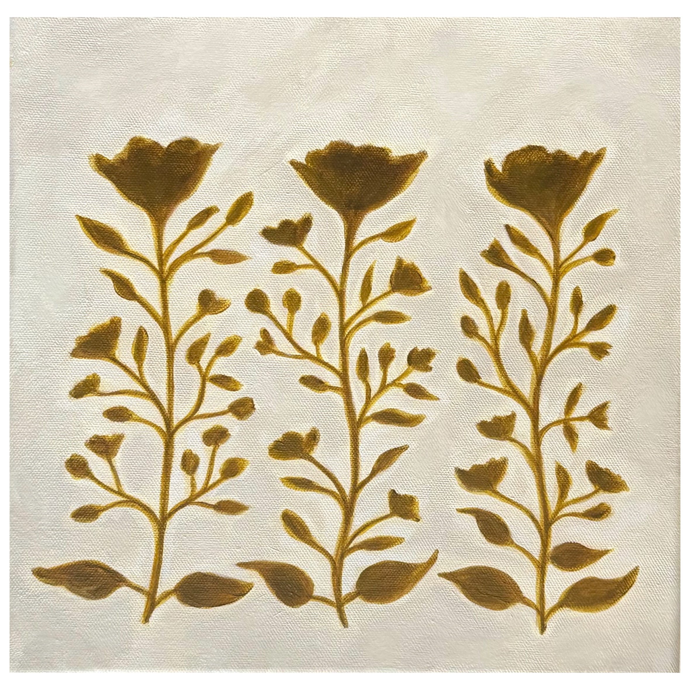 A pattern of three stylized yellow floral designs with flowers, stems, and leaves on a white background.