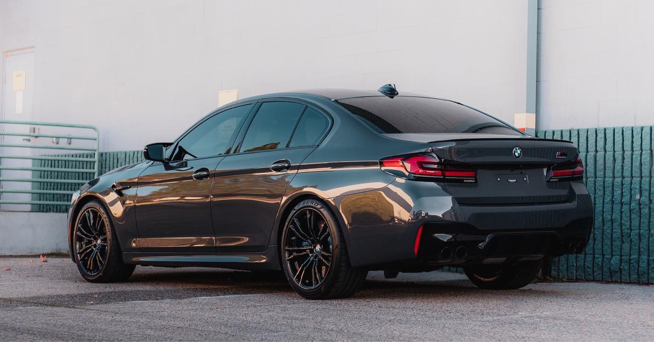 A black BMW M series protected with full body Paint Protection film (PPF)