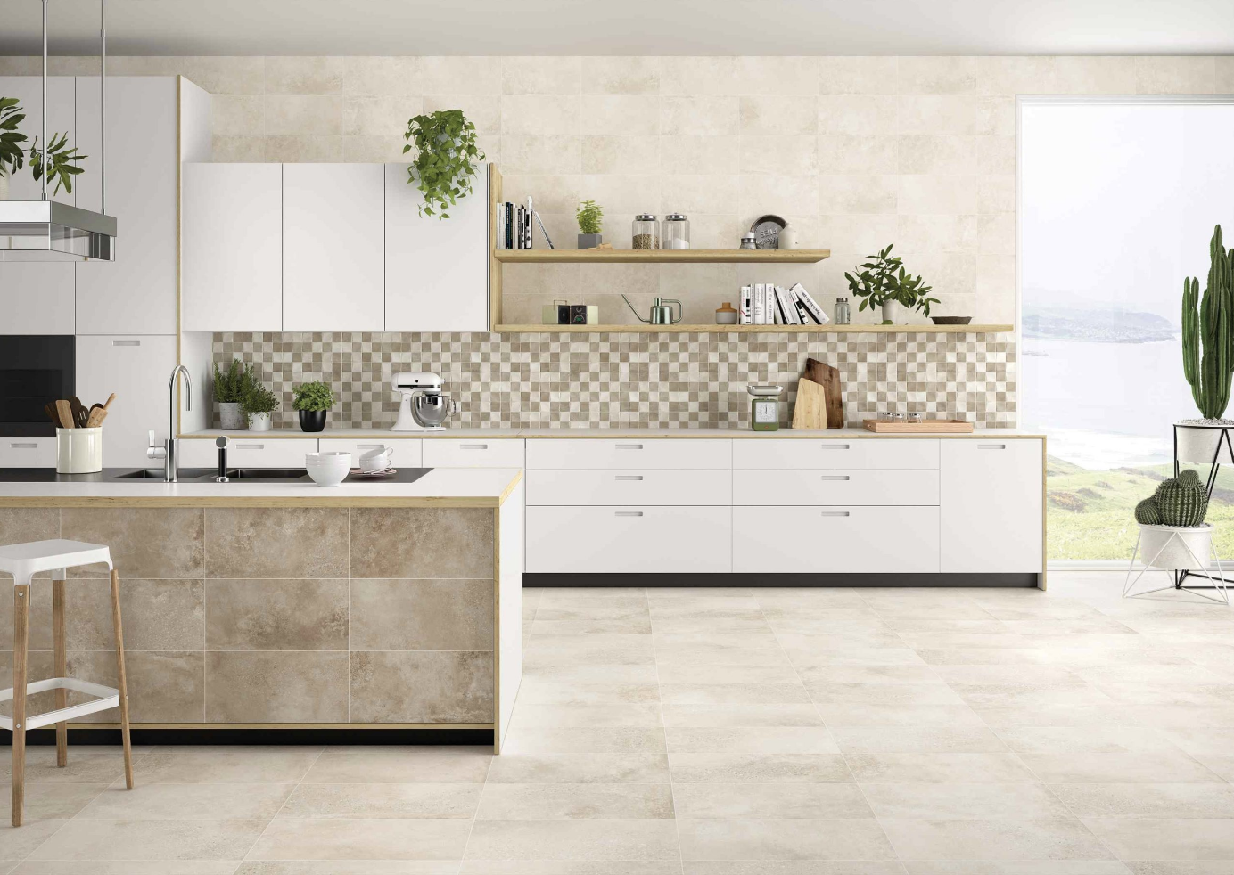 Modern kitchen with white cabinets, beige tiled backsplash, open wooden shelves with plants and kitchen items, beige tiled countertops, and a large window overlooking greenery and water.
