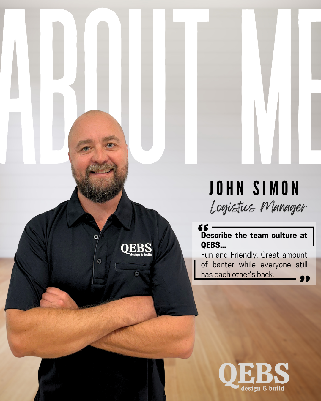 John Simon, Logistics Manager at QEB, standing with crossed arms, smiling in an office space with large text behind him that says 'ABOUT ME', and a quote about team culture on a wall.