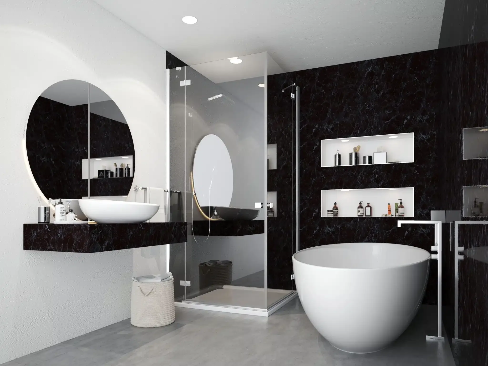 Modern bathroom with a white oval bathtub, black marble walls, a floating black marble vanity with a vessel sink, a large round mirror, wall-mounted shelves with toiletries, a glass-enclosed shower, and a white laundry basket on a gray floor.