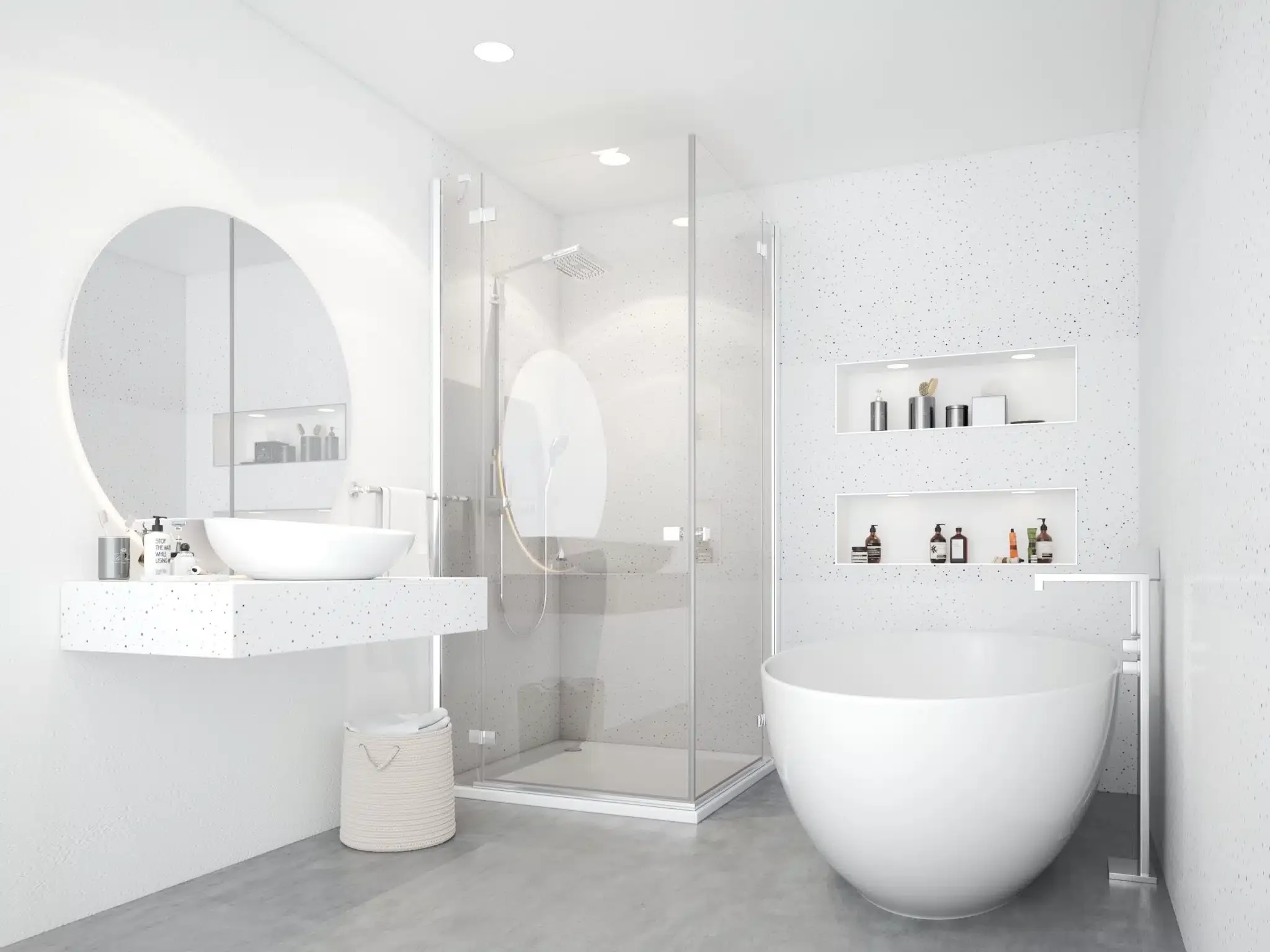 Minimalist white bathroom with large circular mirror, vessel sink on floating speckled white countertop, round freestanding bathtub, glass shower stall with rain shower head, built-in wall shelves with toiletries, towel basket, and neutral gray floor