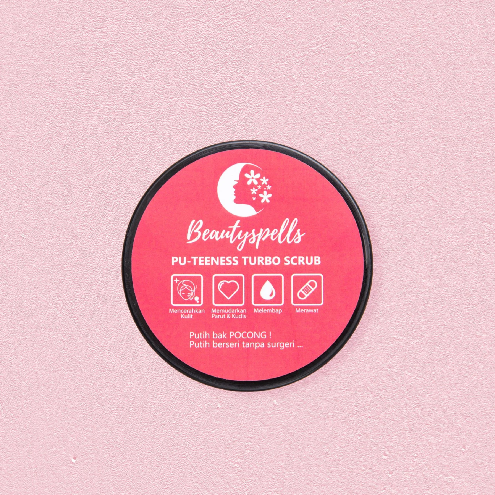 Container of Beautysprills Pu-Teeness Turbo Scrub on pink textured background.