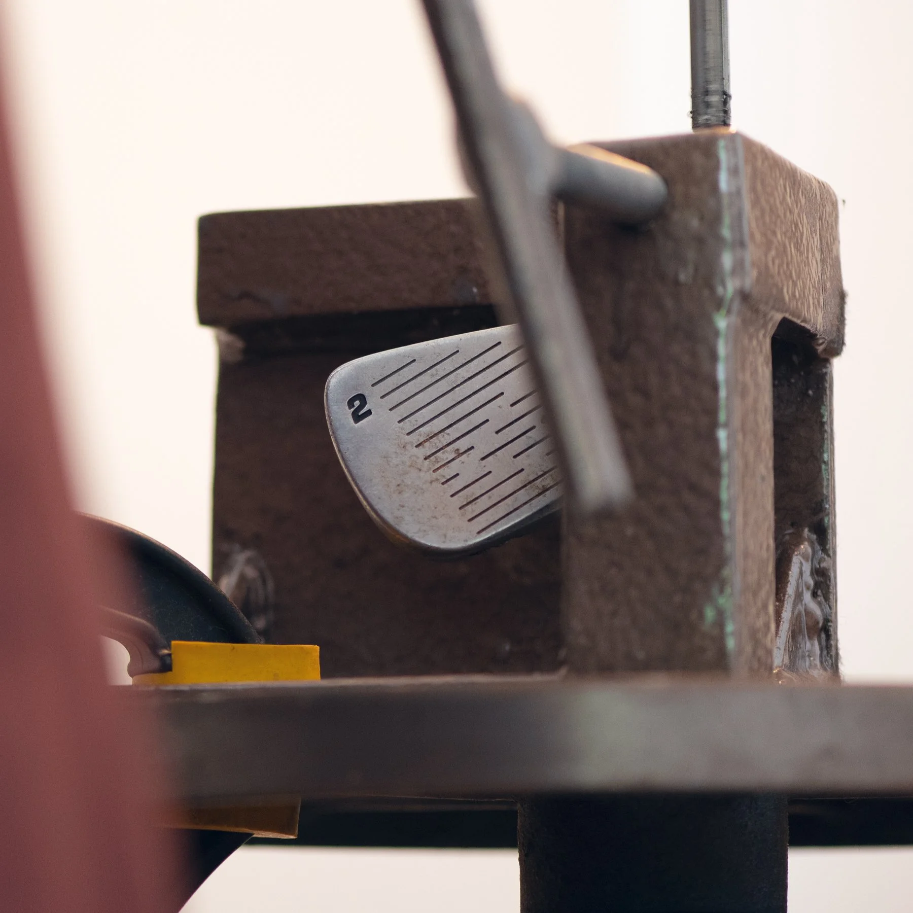 Close-up of a custom golf club repair.