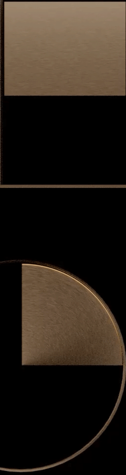 Close-up of a black and gold circular object with a section removed, possibly a decorative item or a piece of machinery.