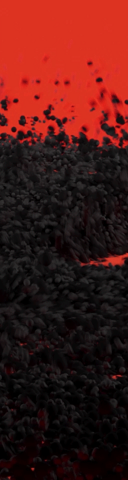 Close-up of volcanic rocks with lava glowing in the background.